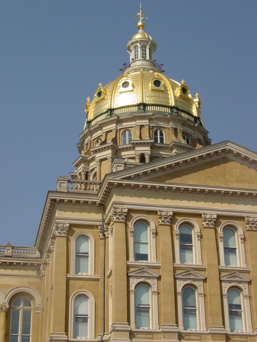 Iowa State Capitol dome against a blue sky