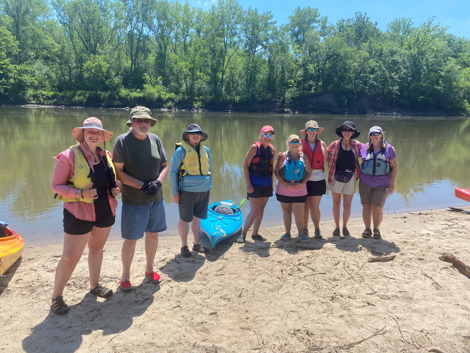 Paddlers on beach of Des Moines River