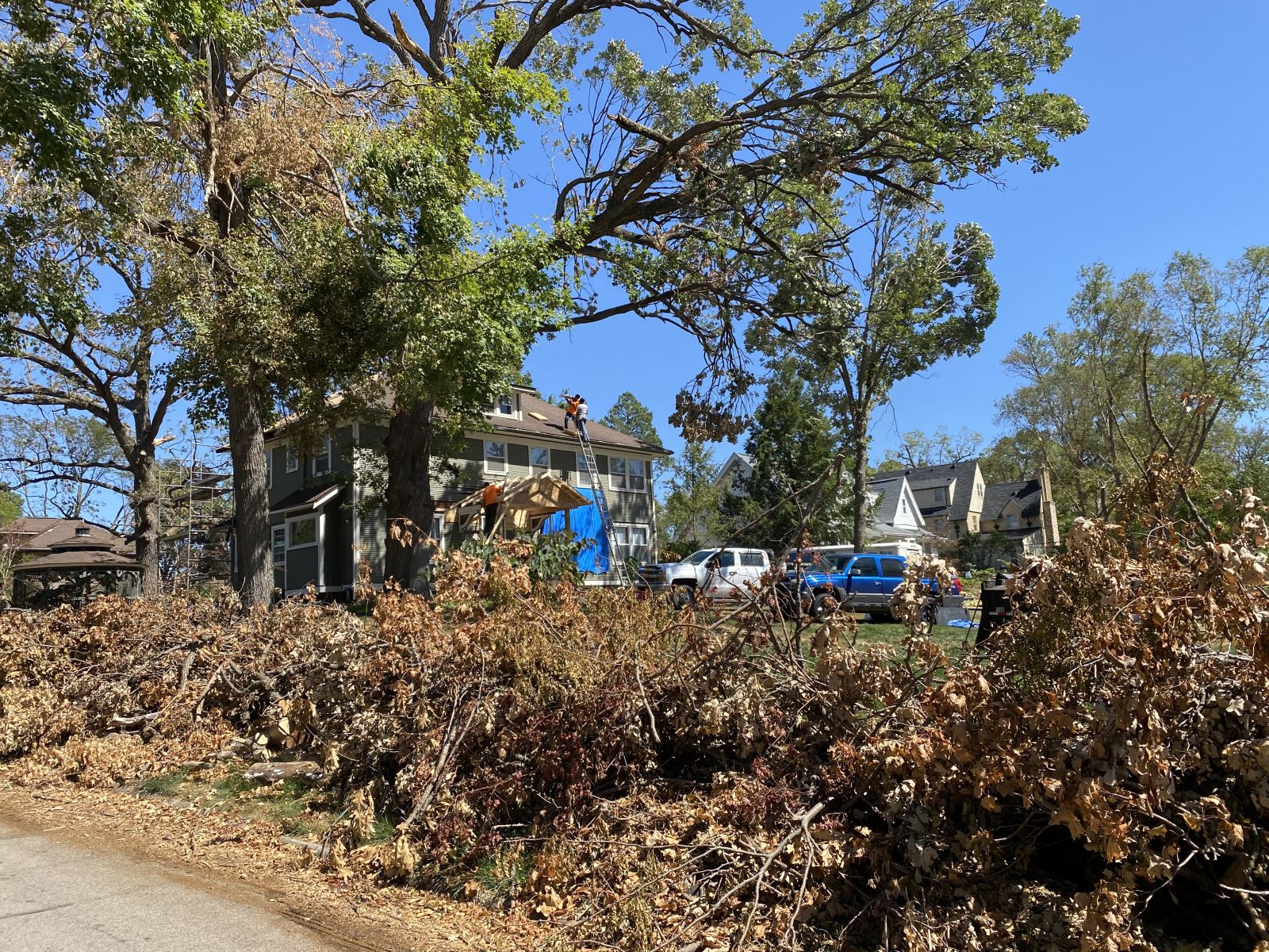 Downed trees in front of a Cedar Rapids home, August 2020