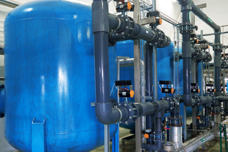 Blue tanks and piping in a line