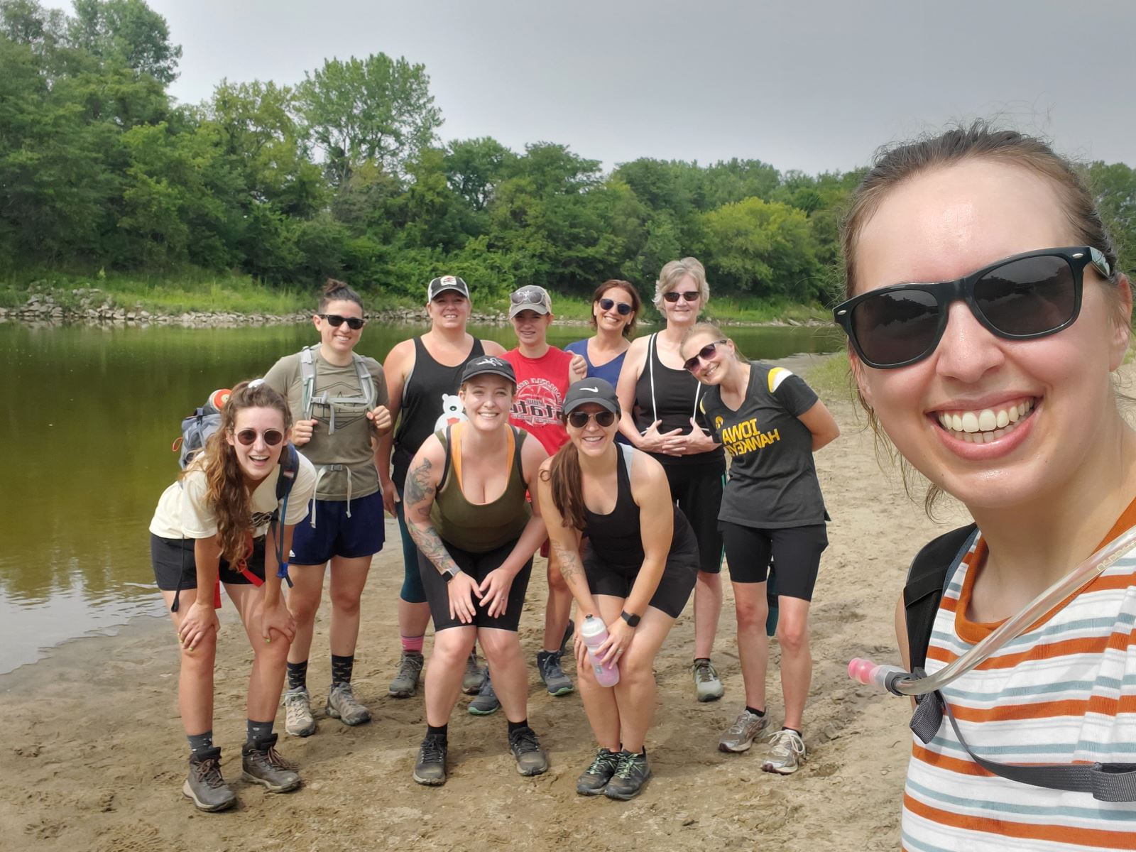 Emily with group on river bank