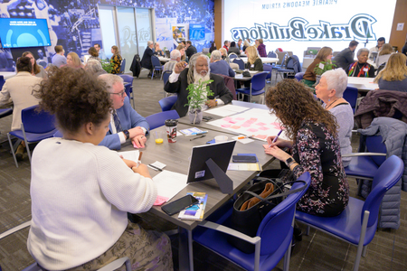 Group having a discussion during IEC's Environmental Justice Summit January 16, 2023