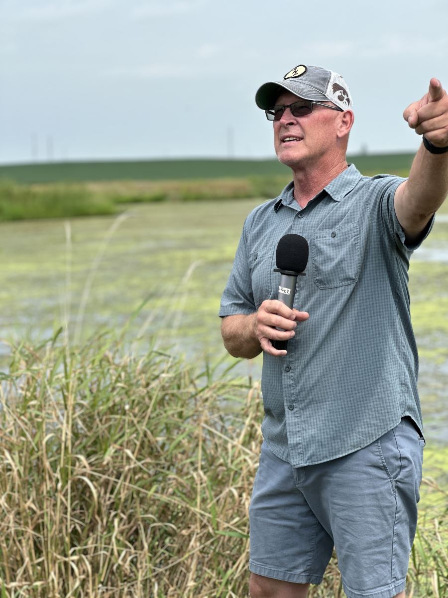O'Connell talking in front of his wetland.