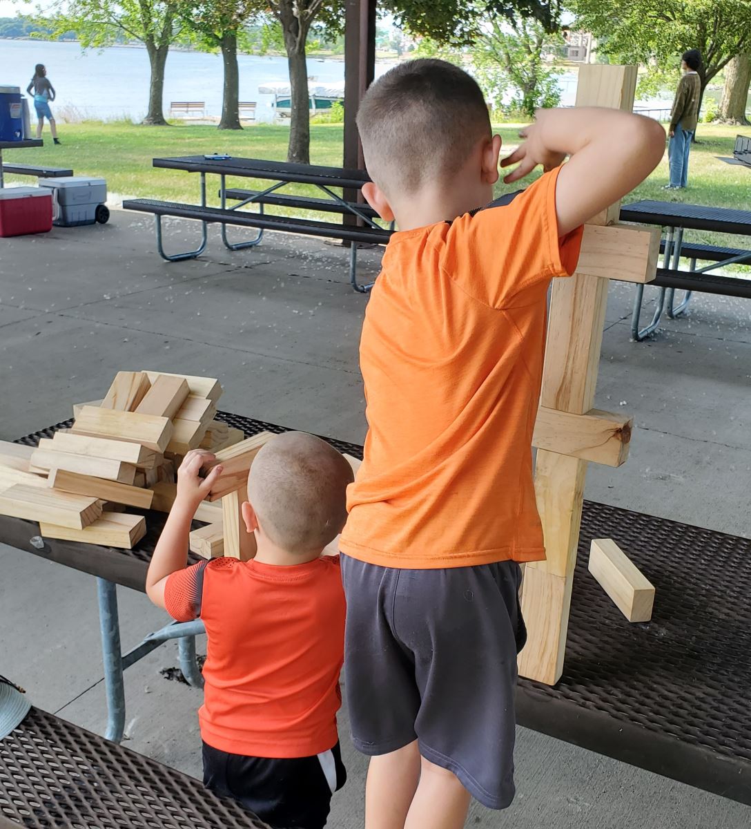 Boys playing with Jenga blocks