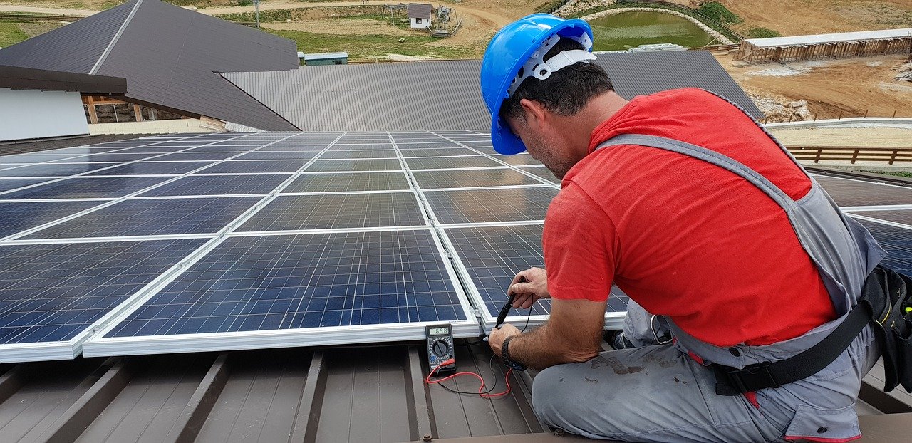 solar installer on roof